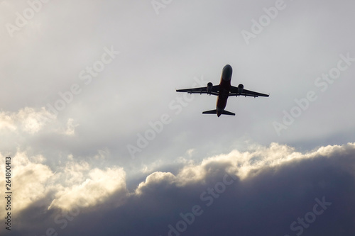 Passenger airplane taking-off in sunset