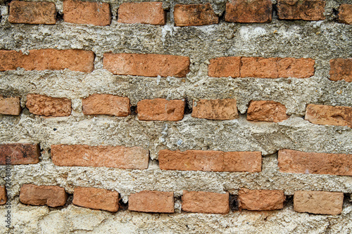 baked clay of red brick in cement for wall