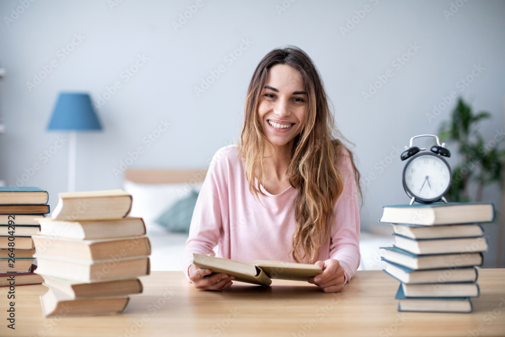 Woman smiling student read books at home. Woman smiling student read books at home.