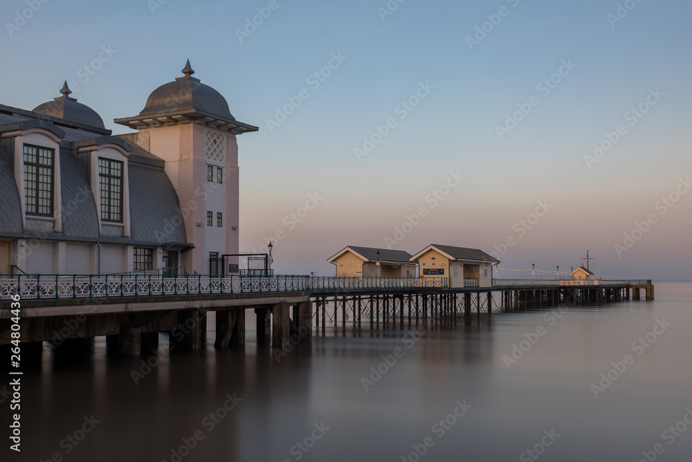 The victorian architecture of Penarth Pier, near Cardiff on the coast of south Wales. The sea is smooth due to a long shutter speed.