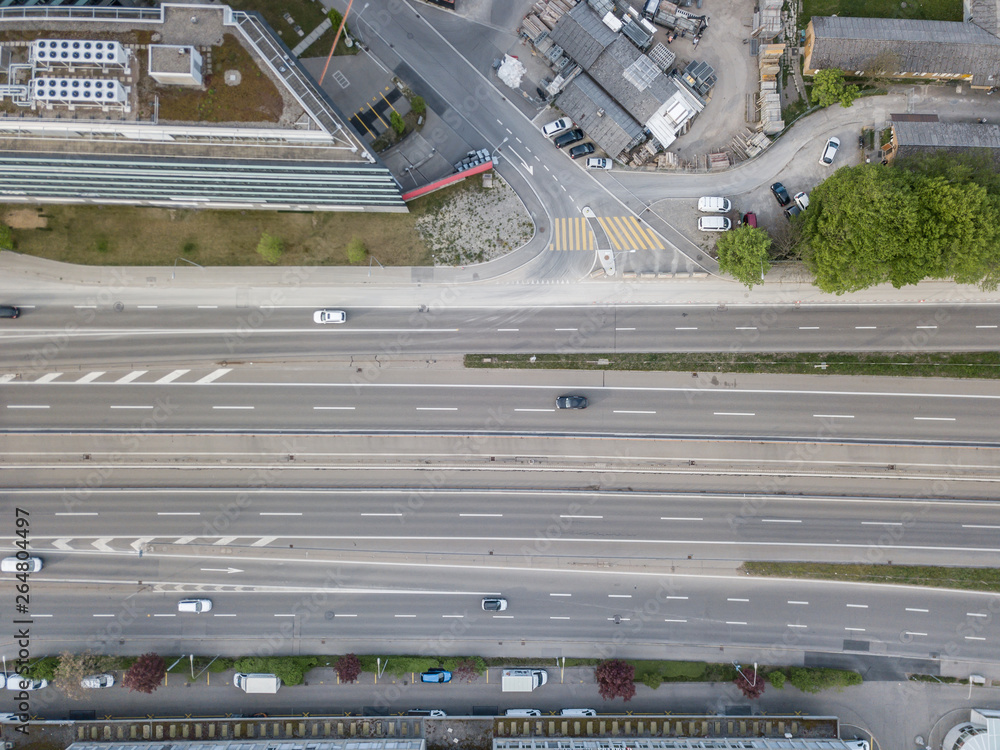 Aerial view of highway through city.