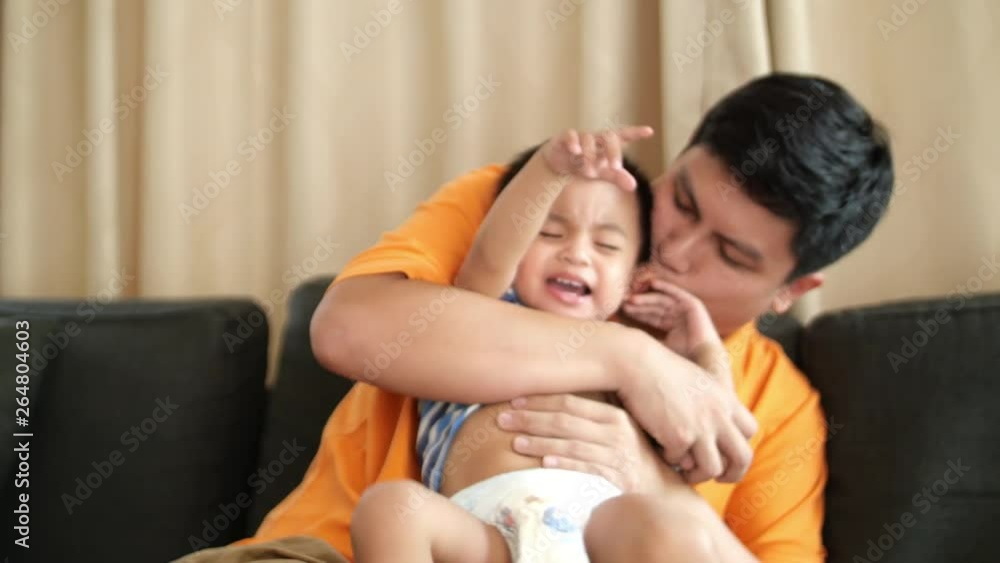 Baby boy playing with father at home Baby boy playing with father at home