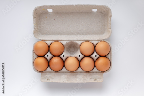 chicken brown eggs in a tray, no one egg, top view