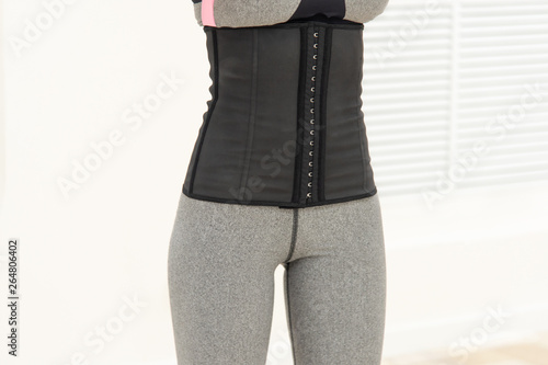 girl in a corset and sports leggings