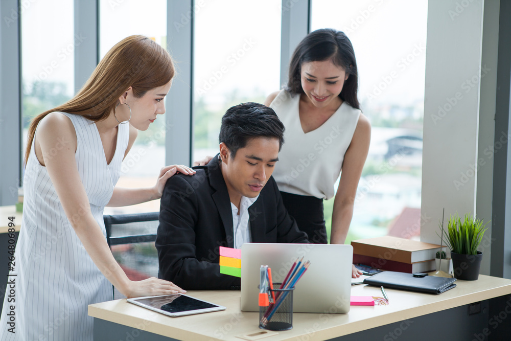 Fototapeta premium Businesswoman gestures and consolation Businessman in the office. team work girl employee patting man colleagues shoulder .consolation, sympathy, encouragement, in workplace
