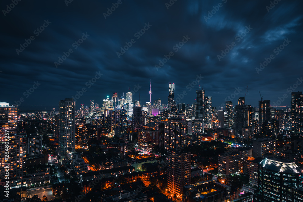 Entire futuristic city skyline view of downtown Toronto Canada. Modern buildings, urban architecture, cars travelling. construction and development in a busy city Entire futuristic city skyline view of downtown Toronto Canada. Modern buildings, urban architecture, cars travelling. construction and development in a busy city