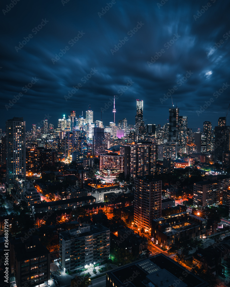Entire futuristic city skyline view of downtown Toronto Canada during a storm. Modern buildings, urban architecture, cars travelling. construction and development in a busy city