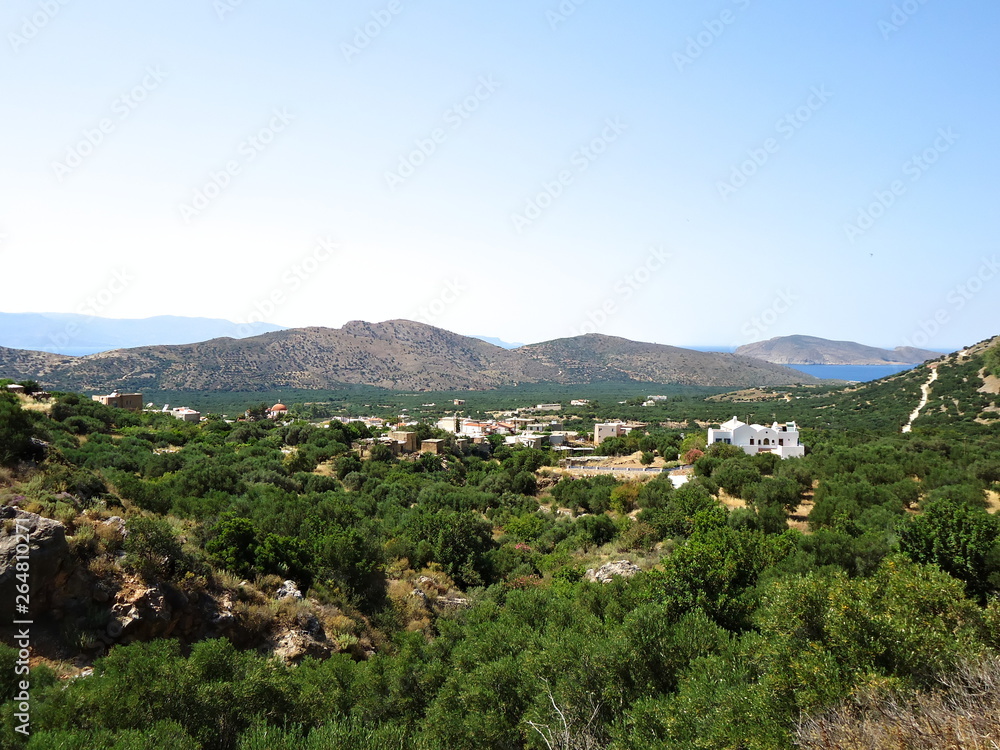 Sunny view of picturesque mountain village on Crete, Greece..