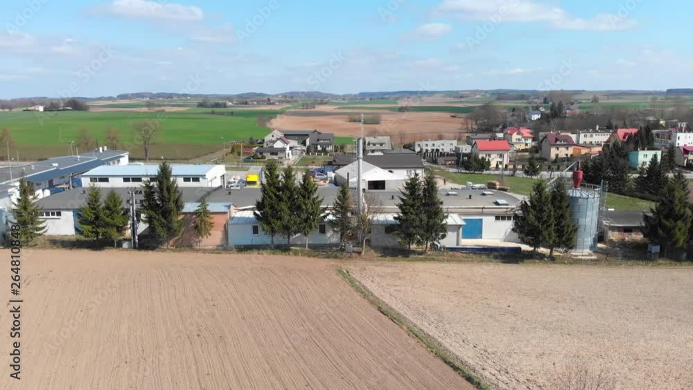Aerial shot of a carpentry workshop located among cultivated fields and small town, Aerial shot of a small factory located among cultivated fields and small country town Aerial shot of a carpentry workshop located among cultivated fields and small town, Aerial shot of a small factory located among cultivated fields and small country town