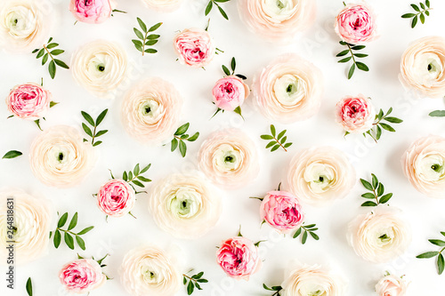 Floral background texture made of pink ranunculusand rose flower buds and eucalyptus leaves on white background. Flat lay, top view floral background.