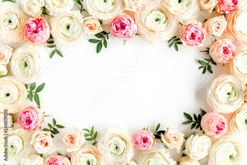 Floral pattern frame made of pink ranunculus and roses flower buds on white background.  Flat lay, top view floral background. © K.Decor