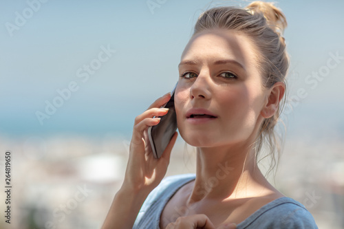 Pretty female speaking on the phone