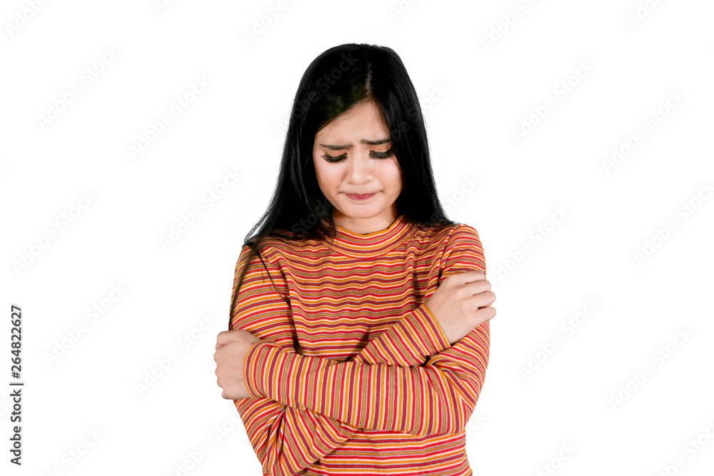 Pretty girl stands with sad expression on studio Pretty girl stands with sad expression on studio