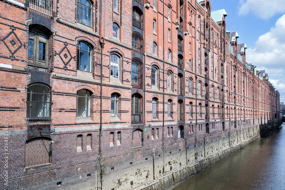 Speicherstadt in Hamburg, Germany. It is the largest warehouse district in the world where the buildings stand on timber-pile foundations and was awarded the status of World Heritage in 2015.