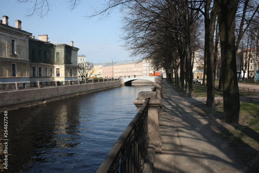 a view of the canal, bridge and building 
