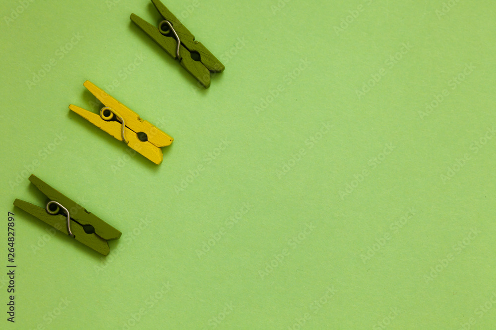 Business concept Empty template copy space isolated Posters coupons promotional material. Outline words green middle yellow paper clip on olive color ground