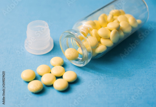 Soothing valerian tablets in a close-up storage container