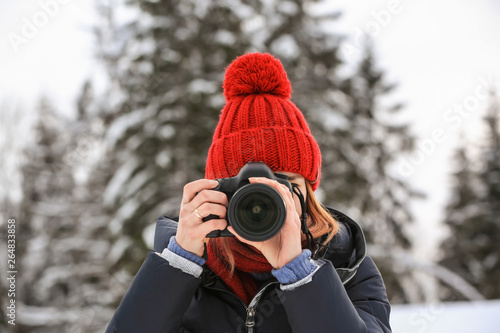 Female photographer at resort on winter day