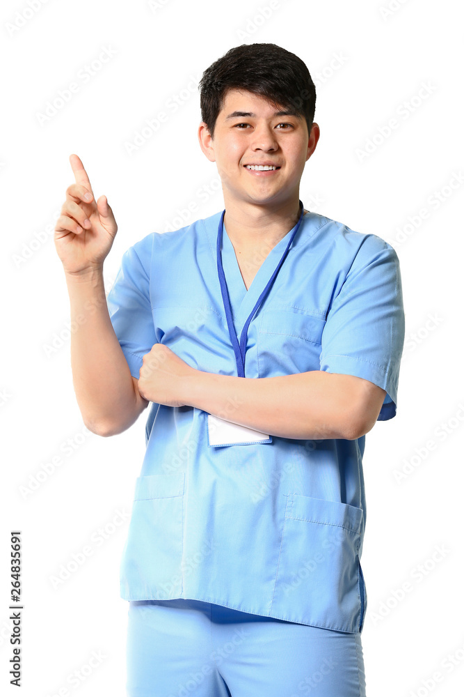 Male medical assistant with raised index finger on white background Male medical assistant with raised index finger on white background
