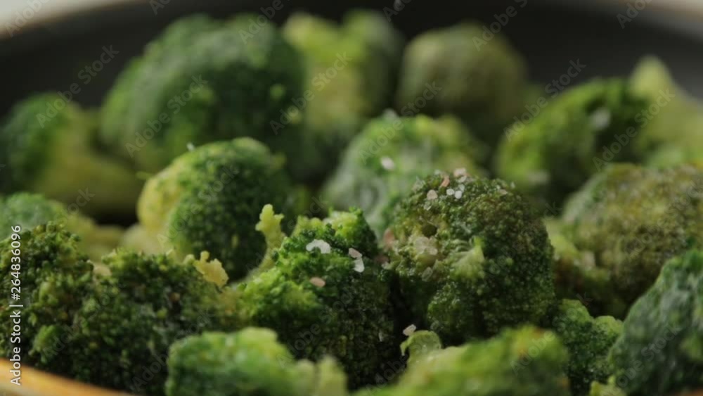 Preparation of fresh green cabbage. Cabbage broccoli in a pan with oil and spices.