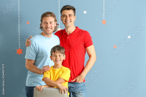 Happy gay couple with adopt...