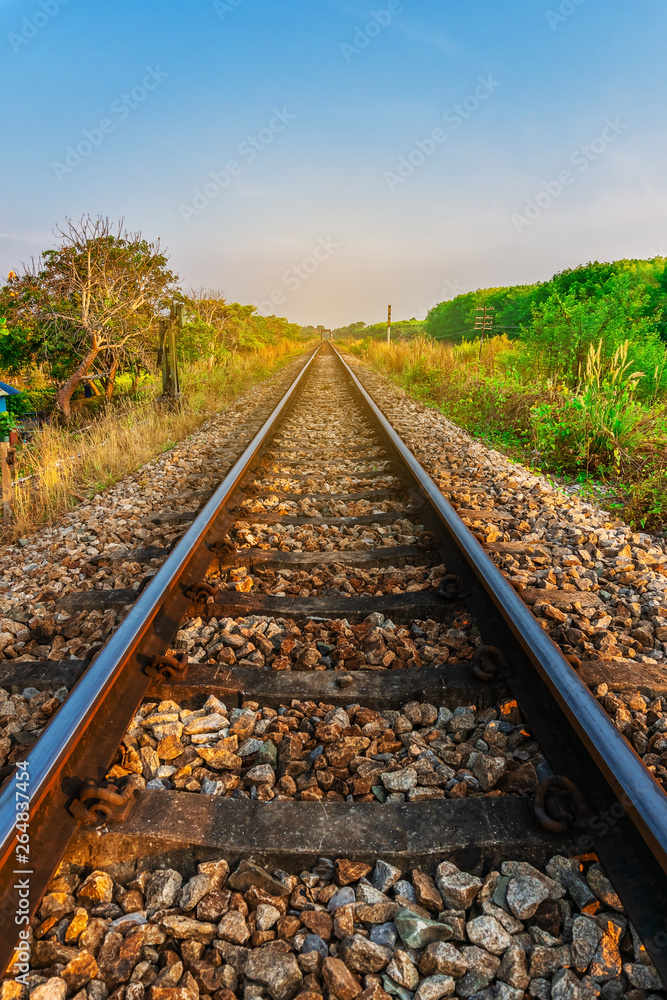 Fototapeta premium Railroad and railway train transportation with color of sky sunlight