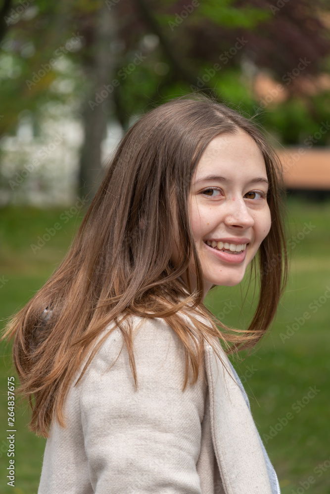 Beautiful young woman posing smiling and looking at the camera Beautiful young woman posing smiling and looking at the camera
