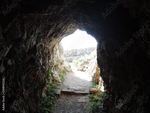 View from inside a rocky cave in Fortezza fortress, the Greek city of Rethymno. The Hill Of Paleokastro. Cave.