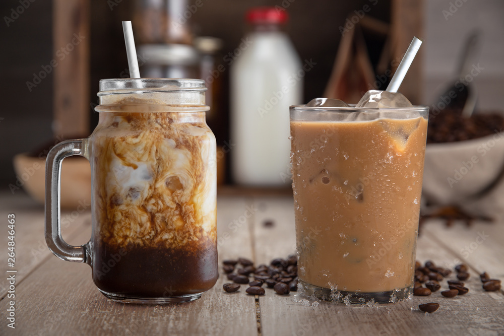 A pair of tasty homemade organic cold brew batch ice coffee drinks, mocha latte, with ingredients. A pair of tasty homemade organic cold brew batch ice coffee drinks, mocha latte, with ingredients.