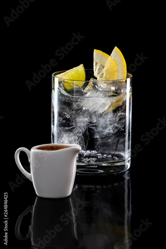 Espresso tonic refreshing drink isolated on black background