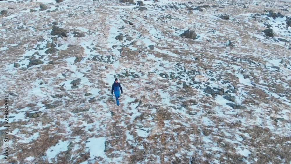 Man training with trekking poles, running cross country, outdoor sport. Winter or spring recreation, male athlete rogaine, rogaining. Man training with trekking poles, running cross country, outdoor sport. Winter or spring recreation, male athlete rogaine, rogaining.