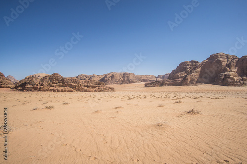 A beautiful day in the Jordanian desert of Wadi Rum. wide dessert with an amazing mountains and sand dunes , amazing scenery that you should see ! 