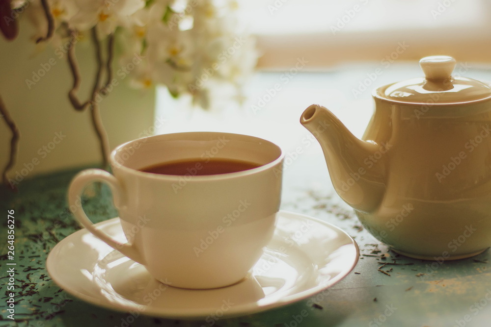 A cup of hot tea with different colours background. A cup of hot tea with different colours background.