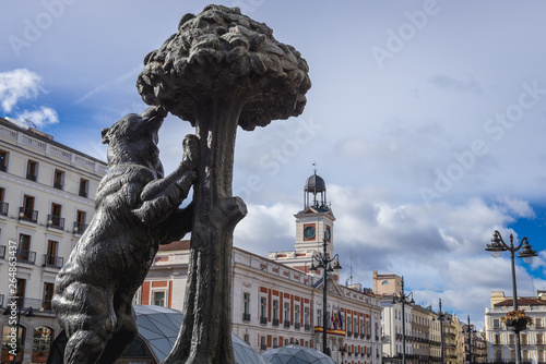 Famous statue of wild bear and strwaberry tree represents the heraldic symbols of Madrid coat of arms, located on Sol Square, Spain