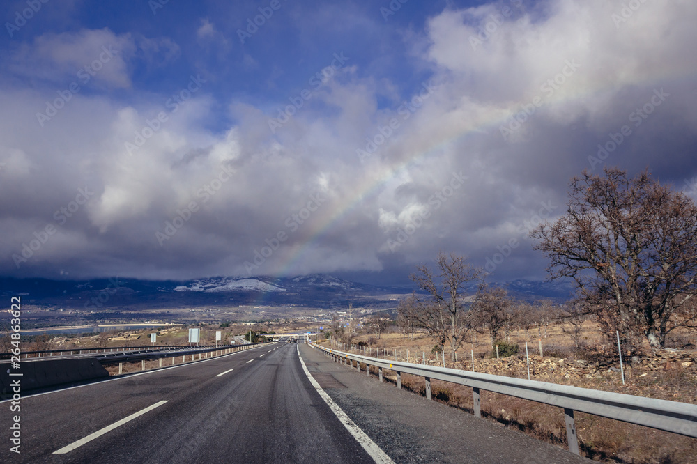 Rainbow over A1 motorway, one of the main roads in Spain Rainbow over A1 motorway, one of the main roads in Spain
