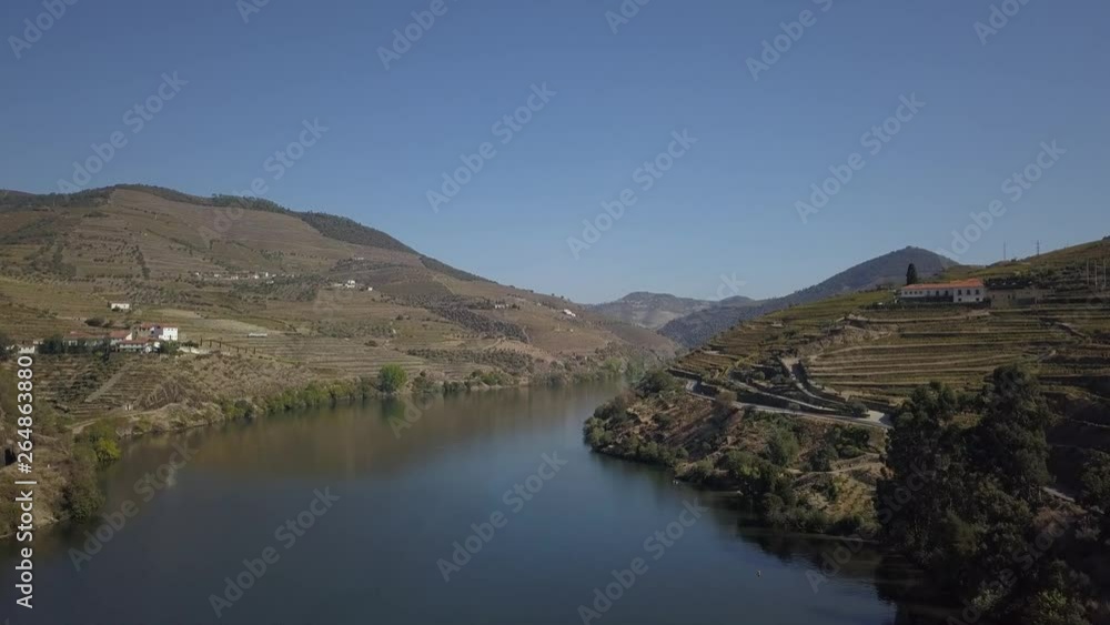 Beautiful aerial view over Douro River waters and landscape, The Nature and the Vineyards of this Unesco Region. Douro Valley Portugal Beautiful aerial view over Douro River waters and landscape, The Nature and the Vineyards of this Unesco Region. Douro Valley Portugal