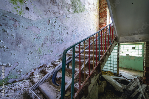 Stairs in abandoned kindergarten in Skrunda ghost town, former USSR military base in Lativa photo