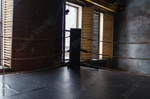View of empty boxing ring in gym. Boxing corner braided Rope Boxing gym