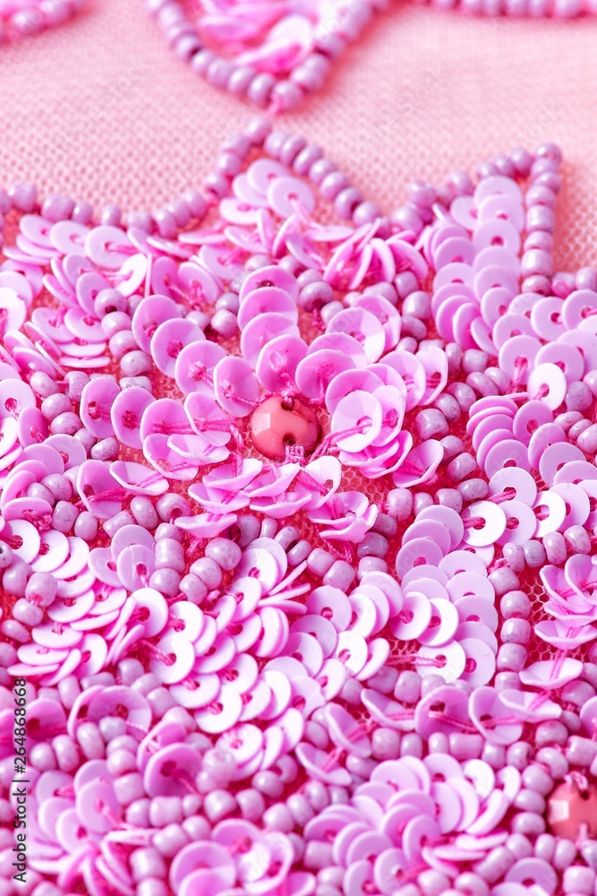 Obraz premium Fabric with sequins and sequins of bright colors. Fashion glitter fabric, sequins. Shiny surface