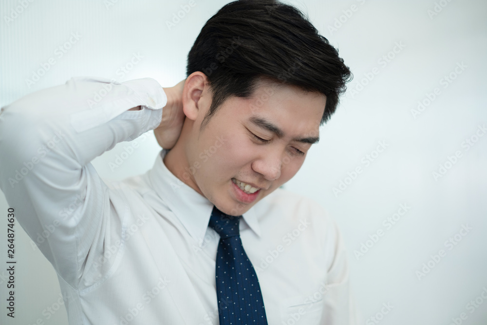 Businessman feel pain in their back while working in the office, medical concept Businessman feel pain in their back while working in the office, medical concept