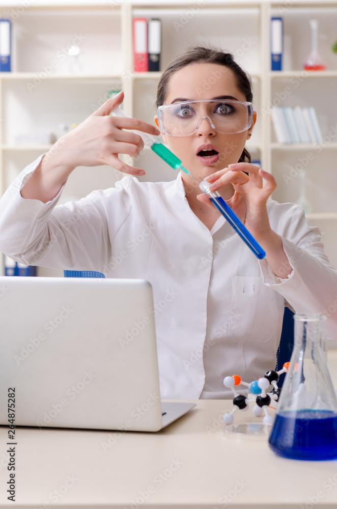Young female chemist working in the lab Young female chemist working in the lab