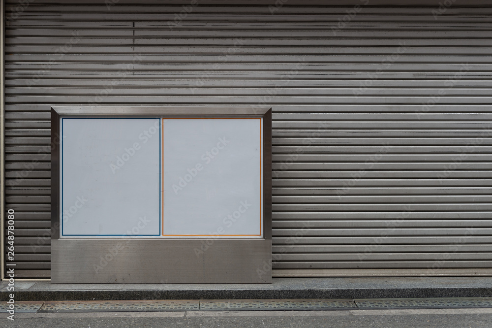 Fototapeta premium Large blank billboard on a street wall, banners with room to add your own text