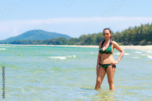 Woman and bikini sexy with daylight on beach