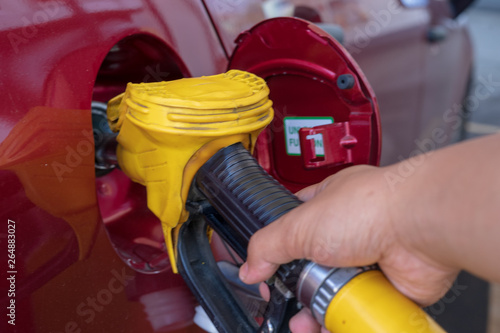 Gas or petrol nozzle for refuel vehicles, close up. Selective focus.