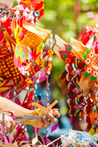 Make Thai style palm leaf carp fish mobile handicraft activities in Songkran festival.