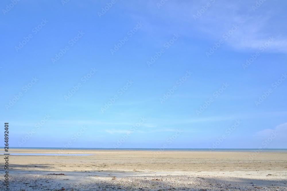 A beautiful sea beach with water waves and a horizontal line,blue sky in bright day A beautiful sea beach with water waves and a horizontal line,blue sky in bright day