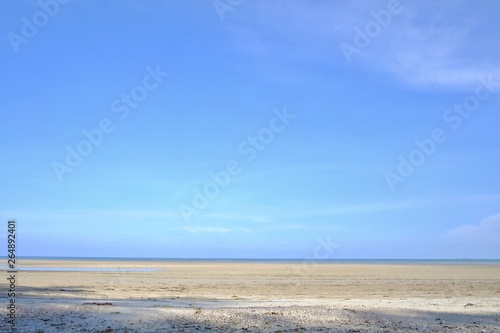 A beautiful sea beach with water waves and a horizontal line,blue sky in bright day