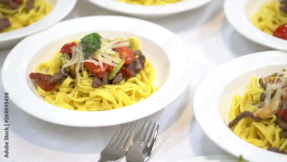 pasta in the plate. table setting in a restaurant.