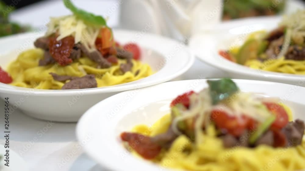 pasta in the plate. table setting in a restaurant. pasta in the plate. table setting in a restaurant.