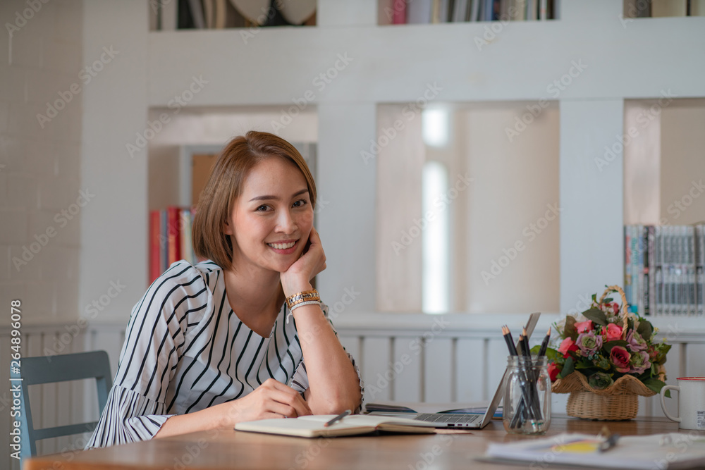 Portrait of beautiful young woman working in the office. Portrait of beautiful young woman working in the office.